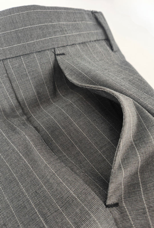 Pantaloni uomo eleganti con tasca America, risvolto e abbottonatura allungata- GRIGIO GESSATO